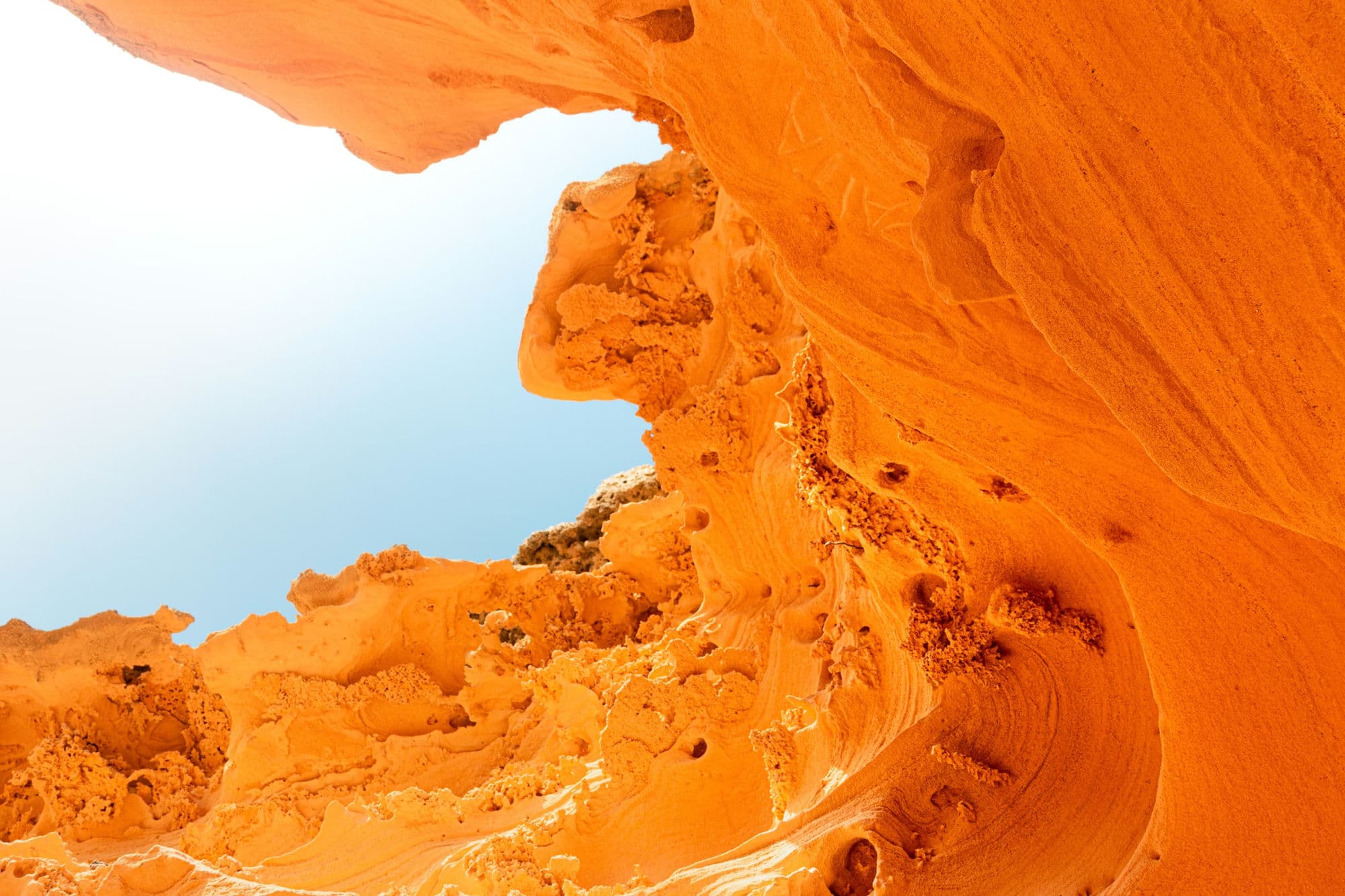 Sparkbites MCP — abstract orange sandstone cave